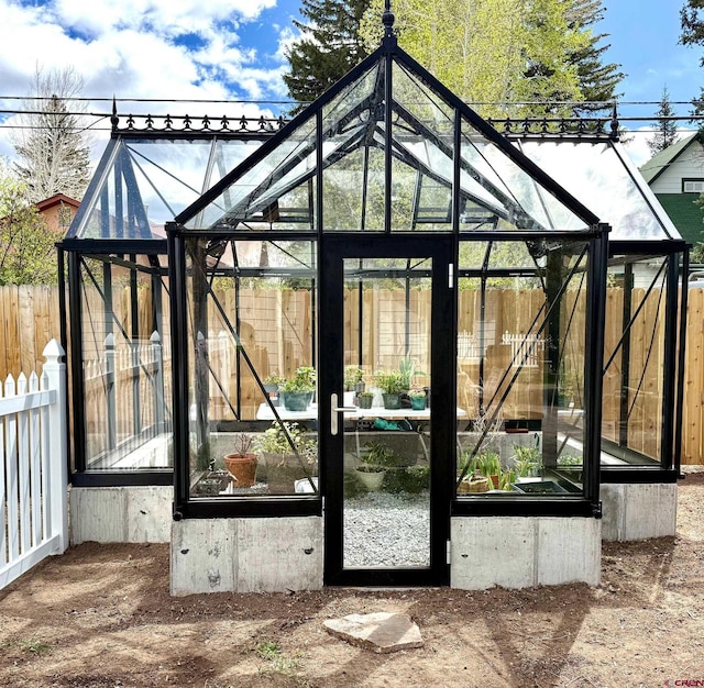 414 N Spruce St, Gunnison, CO 81230 - gate with a greenhouse, fence, and an outdoor structure