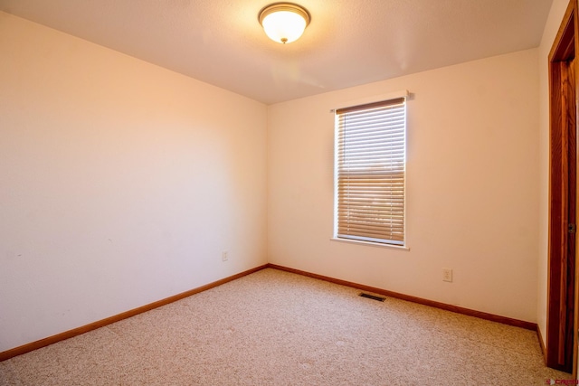 801 L Way, Cortez, CO 81321 - unfurnished room featuring light carpet and baseboards