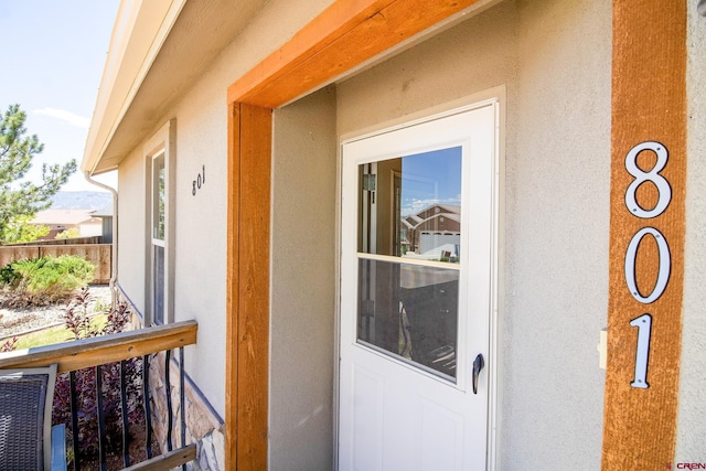 801 L Way, Cortez, CO 81321 - entrance to property featuring stucco siding and fence