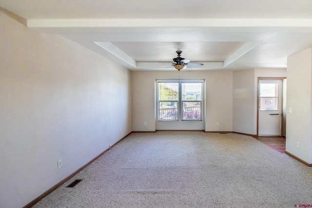 801 L Way, Cortez, CO 81321 - empty room featuring light carpet, a raised ceiling, a ceiling fan, and baseboards