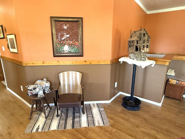 8041/2 S Broadway, Cortez, CO 81321 - sitting room featuring wood finished floors, ornamental molding, and baseboards