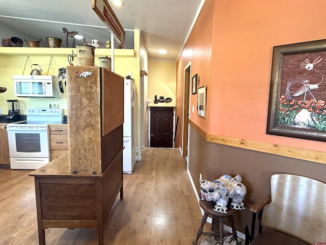 8041/2 S Broadway, Cortez, CO 81321 - kitchen with white appliances, wood finished floors, and recessed lighting