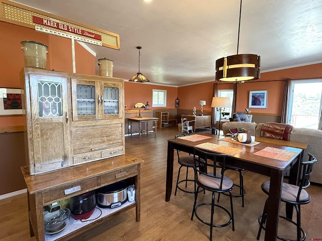 8041/2 S Broadway, Cortez, CO 81321 - dining area featuring wood finished floors, ornamental molding, and baseboards