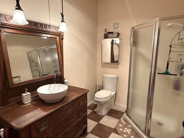8041/2 S Broadway, Cortez, CO 81321 - full bathroom featuring a shower stall, vanity, toilet, and baseboards