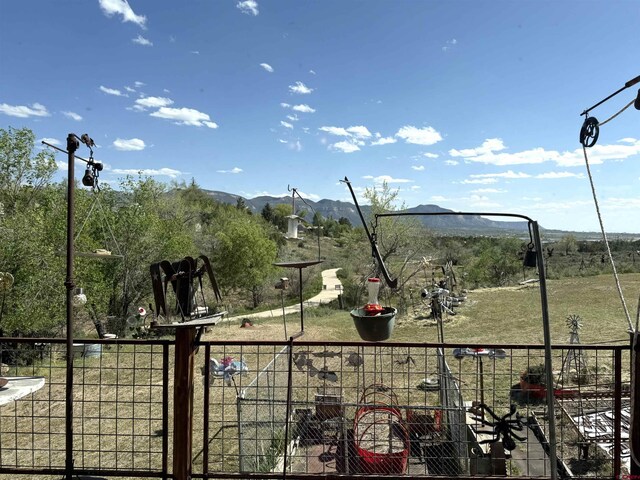 8041/2 S Broadway, Cortez, CO 81321 - view of yard featuring a mountain view and fence