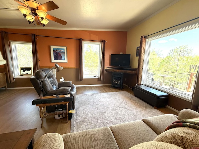 8041/2 S Broadway, Cortez, CO 81321 - living room featuring wood finished floors, crown molding, baseboards, and ceiling fan