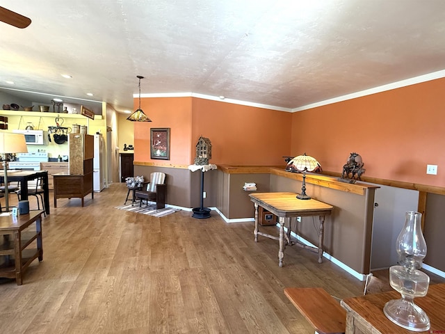 8041/2 S Broadway, Cortez, CO 81321 - dining area with wood finished floors, crown molding, baseboards, and recessed lighting