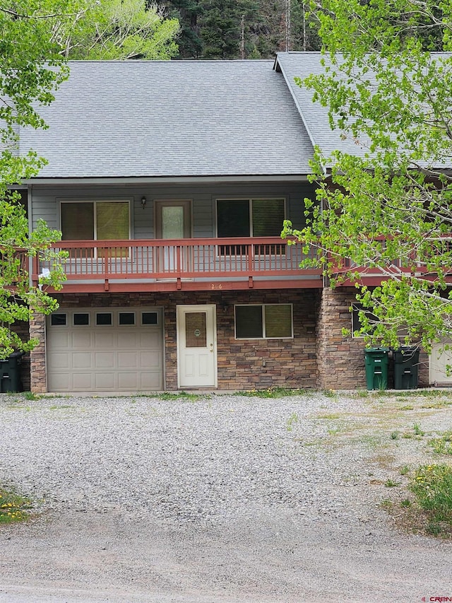 1286 Main St Unit 2, Ouray, CO 81432 - view of front of home featuring a garage and a shingled roof