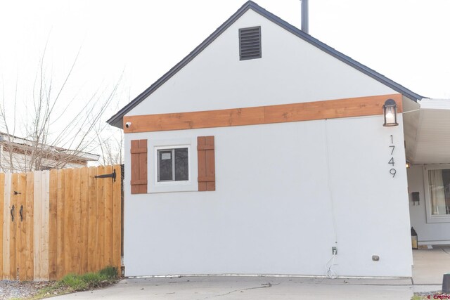 1749 N 15th St, Grand Junction, CO 81501 - view of side of property with fence and stucco siding