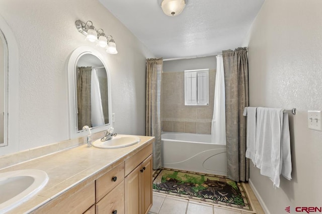 19496 E Rd, Delta, CO 81416 - bathroom with tile patterned flooring, double vanity, a textured wall, and shower / tub combo