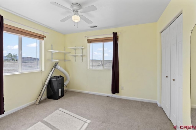 19496 E Rd, Delta, CO 81416 - unfurnished bedroom featuring a closet, carpet, baseboards, and ceiling fan