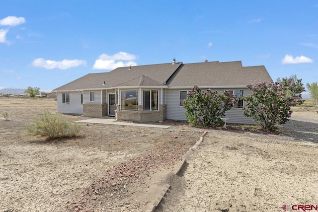 19496 E Rd, Delta, CO 81416 - back of property featuring brick siding