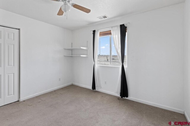 19496 E Rd, Delta, CO 81416 - empty room with carpet flooring, baseboards, and ceiling fan