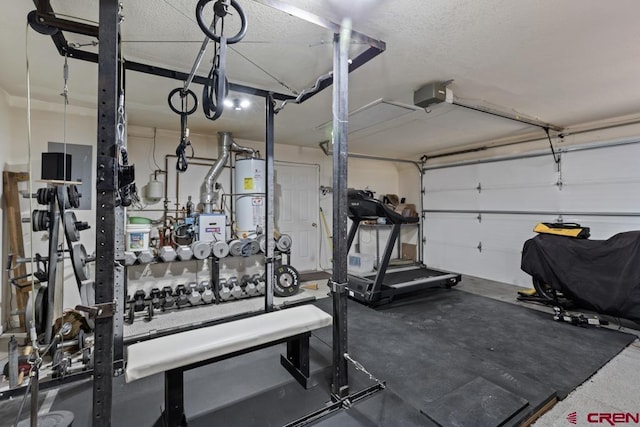 19496 E Rd, Delta, CO 81416 - gym featuring gas water heater, a garage, and a textured ceiling
