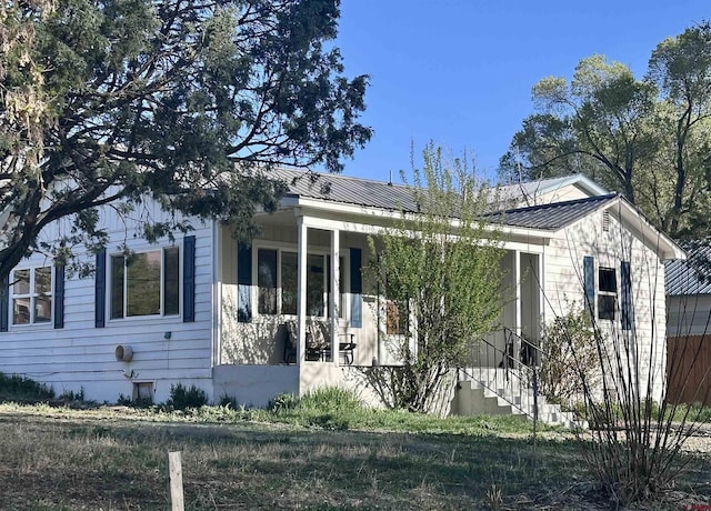 2375 W 2nd Ave, Durango, CO 81301 - view of side of home featuring covered porch and metal roof