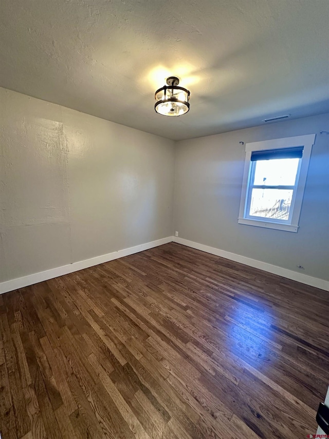 2375 W 2nd Ave, Durango, CO 81301 - empty room featuring dark wood-style floors and baseboards