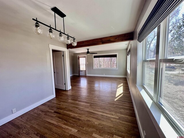 2375 W 2nd Ave, Durango, CO 81301 - unfurnished dining area featuring dark wood finished floors, baseboards, ceiling fan, and beam ceiling