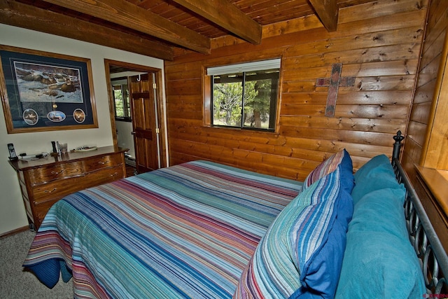 bedroom with carpet flooring, wooden ceiling, beam ceiling, and wooden walls