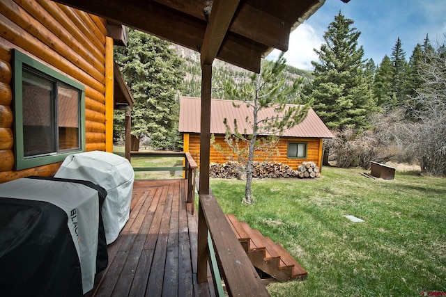 deck with a yard and a grill