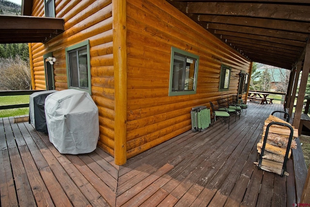 wooden deck featuring grilling area