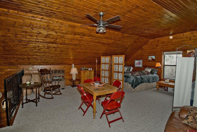 carpeted dining area featuring ceiling fan, wooden ceiling, wood walls, and lofted ceiling