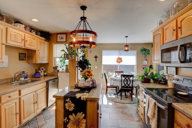 1546 Golf Course Ln, Cortez, CO 81321 - kitchen featuring appliances with stainless steel finishes, a sink, pendant lighting, a center island, and light stone countertops