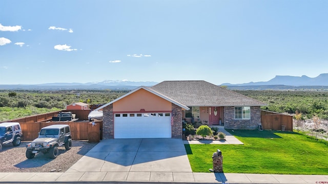 1546 Golf Course Ln, Cortez, CO 81321 - view of front of house with a mountain view, a garage, concrete driveway, and roof with shingles
