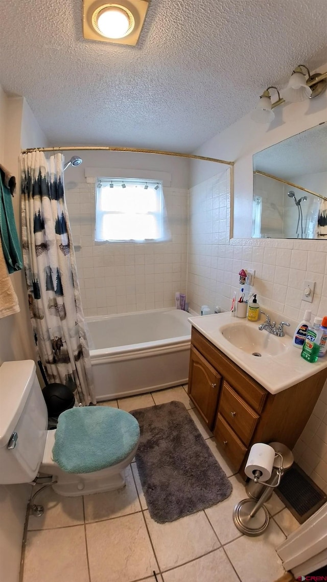 230 NW 5th St, Cedaredge, CO 81413 - bathroom featuring tile patterned floors, shower / bathtub combination with curtain, toilet, tile walls, and vanity