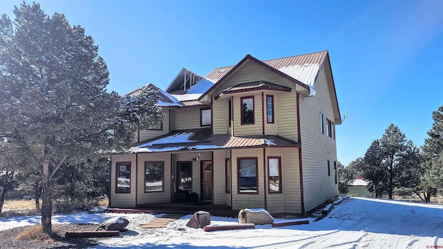 46 Camino Baca Grande, Crestone, CO 81131 - view of front facade with a porch and metal roof