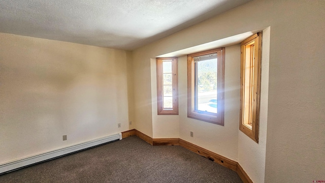46 Camino Baca Grande, Crestone, CO 81131 - carpeted empty room featuring a baseboard radiator and baseboards