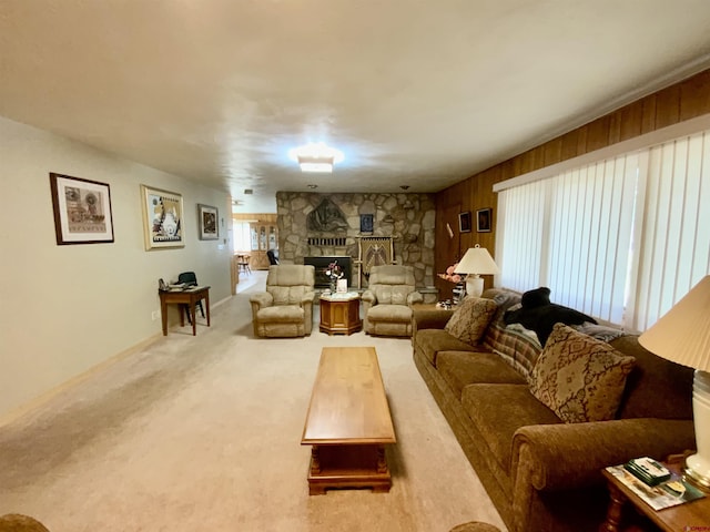 622 Rio Vista Rd, Gunnison, CO 81230 - living area featuring a fireplace, carpet, and wood walls