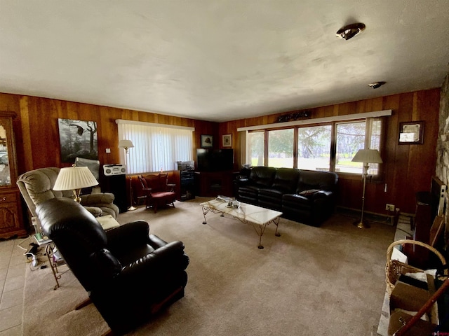 622 Rio Vista Rd, Gunnison, CO 81230 - living area with wood walls, plenty of natural light, and light carpet