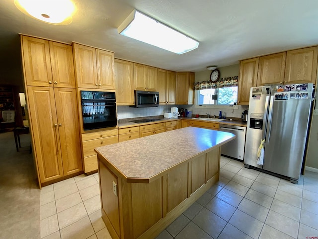 622 Rio Vista Rd, Gunnison, CO 81230 - kitchen with black appliances, a sink, light tile patterned flooring, a center island, and light countertops