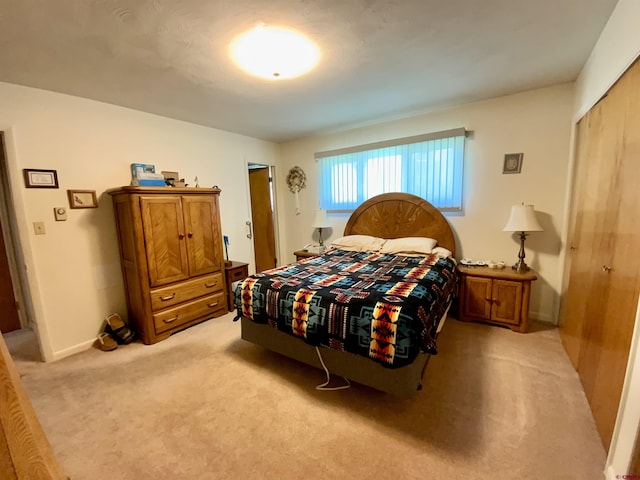622 Rio Vista Rd, Gunnison, CO 81230 - bedroom featuring light colored carpet, a closet, and baseboards