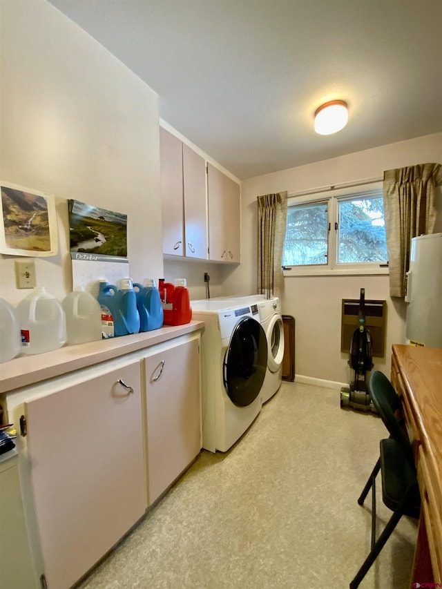 622 Rio Vista Rd, Gunnison, CO 81230 - washroom with washer and dryer, cabinet space, baseboards, and heating unit