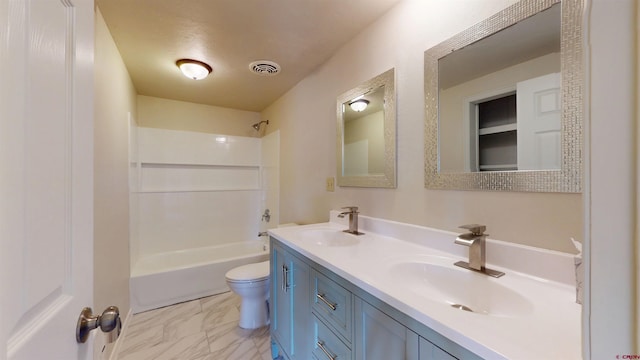 15 Tomichi Ln, Gunnison, CO 81230 - full bathroom with double vanity, toilet, shower / washtub combination, and marble look tiles
