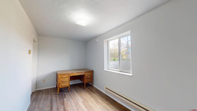 15 Tomichi Ln, Gunnison, CO 81230 - office area with a baseboard radiator, light wood-type flooring, and baseboards