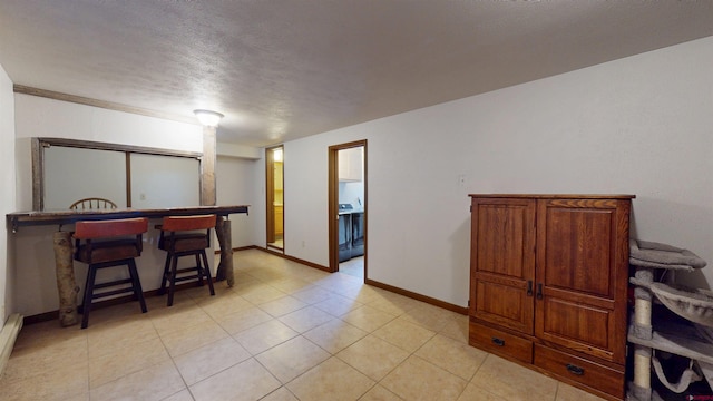 15 Tomichi Ln, Gunnison, CO 81230 - dining area featuring a textured ceiling, baseboards, and baseboard heating
