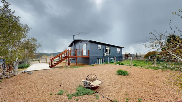 15 Tomichi Ln, Gunnison, CO 81230 - back of house featuring stairway and a patio area