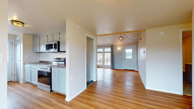 15 Tomichi Ln, Gunnison, CO 81230 - kitchen with appliances with stainless steel finishes, light wood-style floors, and baseboards