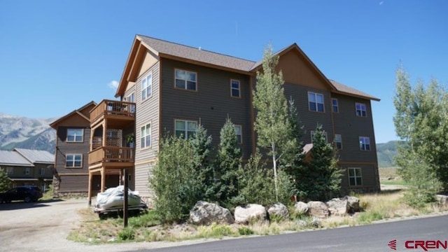 25 Elk Valley Rd Unit 202, Crested Butte, CO 81224 - view of home's exterior with a balcony and a mountain view