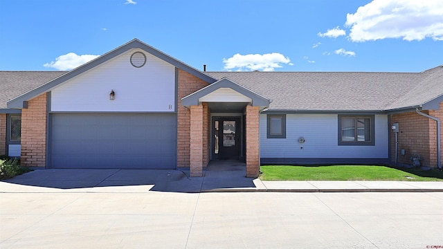 15 Sunnybrook Pl, Alamosa, CO 81101 - single story home with driveway, an attached garage, roof with shingles, and brick siding