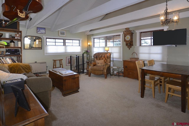 402 Sopris Ave, Crested Butte, CO 81224 - carpeted living room featuring healthy amount of natural light and a chandelier