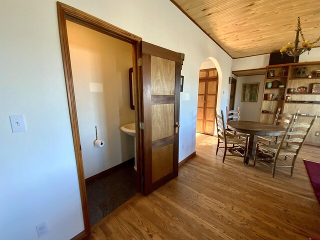 865 County Road 17, Gunnison, CO 81230 - dining area with arched walkways, wood finished floors, lofted ceiling, wood ceiling, and baseboards