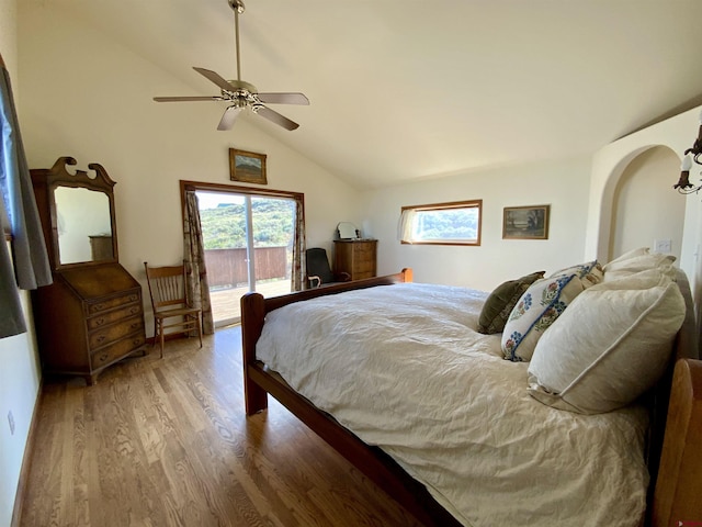 865 County Road 17, Gunnison, CO 81230 - bedroom featuring access to exterior, lofted ceiling, wood finished floors, and a ceiling fan