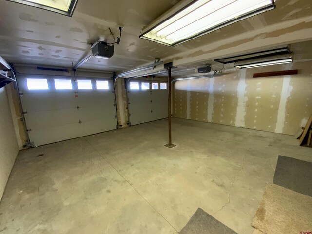 865 County Road 17, Gunnison, CO 81230 - garage featuring a garage door opener
