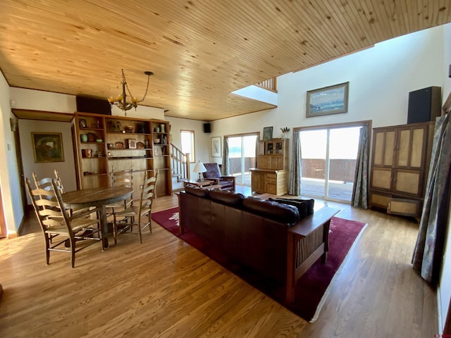 865 County Road 17, Gunnison, CO 81230 - living area with a chandelier, wood finished floors, and wood ceiling