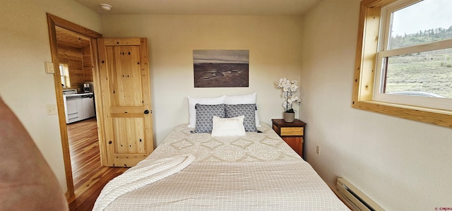 11975 US Highway 50, Gunnison, CO 81230 - bedroom featuring wood finished floors and baseboard heating