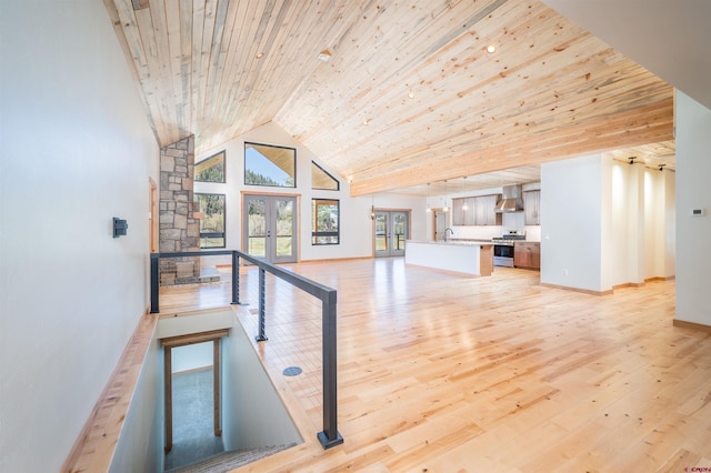 26217 Rd 38.5, Dolores, CO 81323 - unfurnished living room with high vaulted ceiling, french doors, light wood-style flooring, baseboards, and wooden ceiling