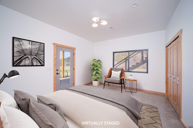 26217 Rd 38.5, Dolores, CO 81323 - bedroom featuring light colored carpet, baseboards, access to exterior, and a closet